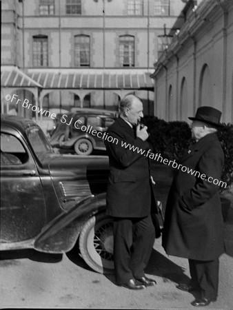 REV CLERICS OUTSIDE HOUSE WITH CAR